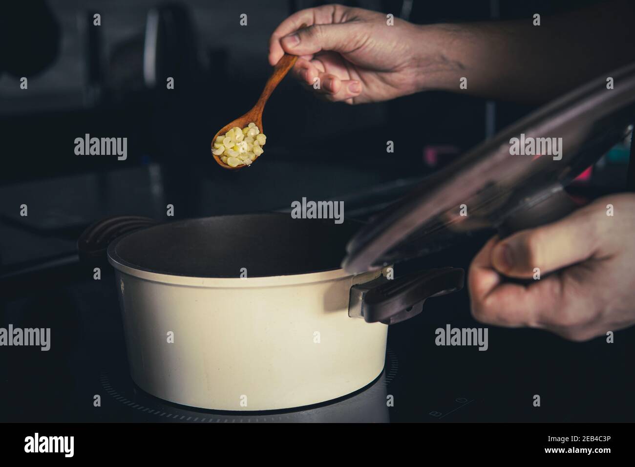 cooking pea porridge in a saucepan on an induction cooker Stock Photo