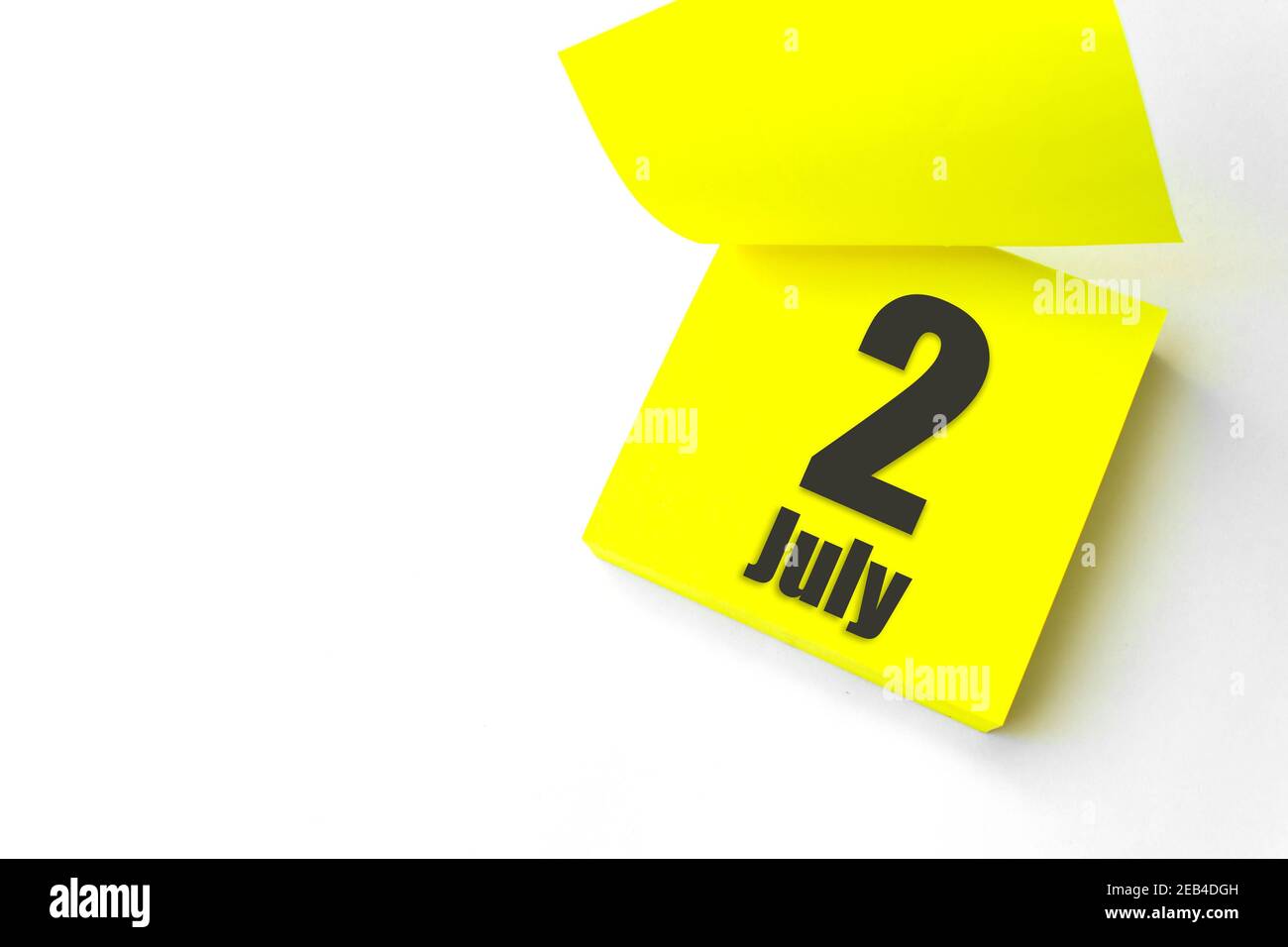 July 2nd. Day 2 of month, Calendar date. Close-Up Blank Yellow paper reminder sticky note on White Background. Summer month, day of the year concept Stock Photo