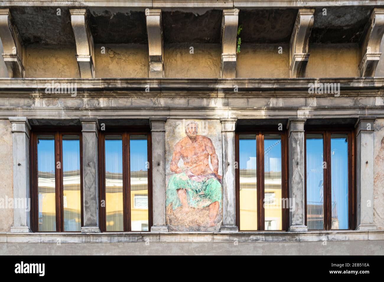 Udine, Italy. February 11, 2020. the facade of the Sabbadini House, built in the 16th century with the fresco of Jupiter, painted by G.B. Bassi Stock Photo