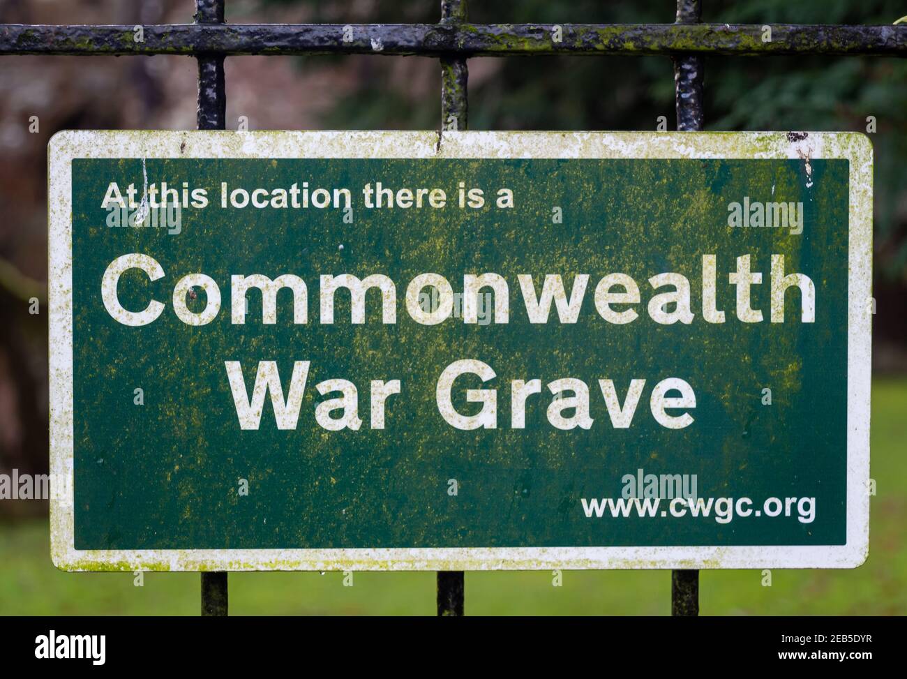 Tongland, Scotland - December 21st 2020: Green Commonwealth War Grave sign at Tongland cemetery, Galloway, Scotland Stock Photo