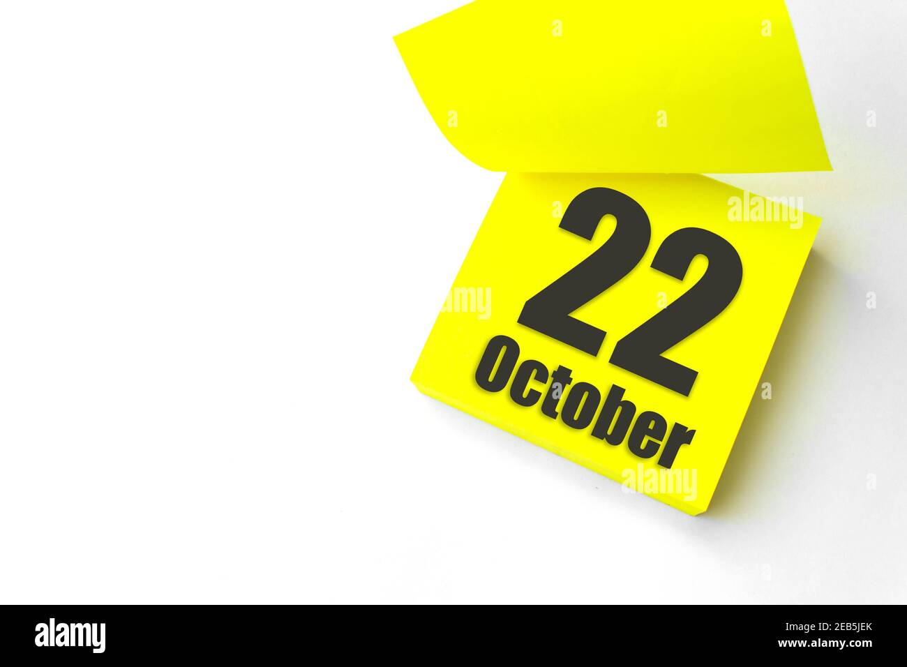 October 22nd. Day 22 of month, Calendar date. Close-Up Blank Yellow paper reminder sticky note on White Background. Autumn month, day of the year conc Stock Photo