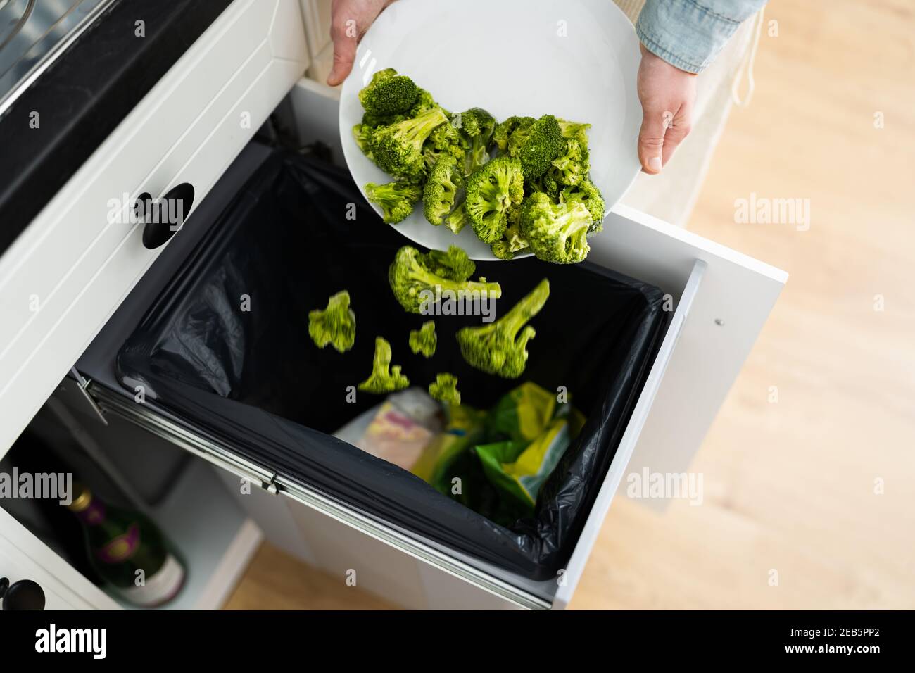 Throwing Away Leftover Food In Trash Or Garbage Dustbin Stock Photo Alamy