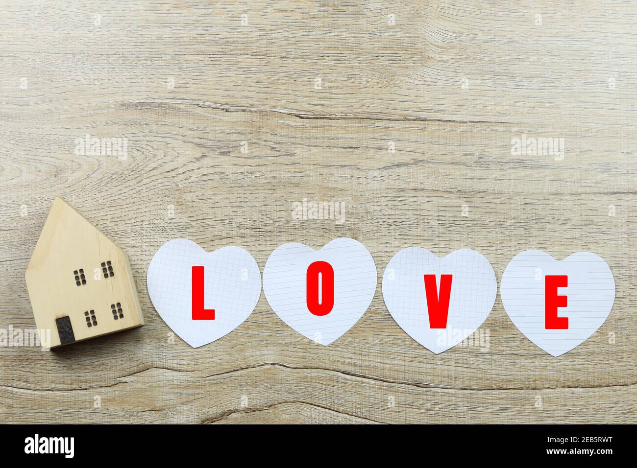 Paper heart shape and wooden house and have copy space for design in ...