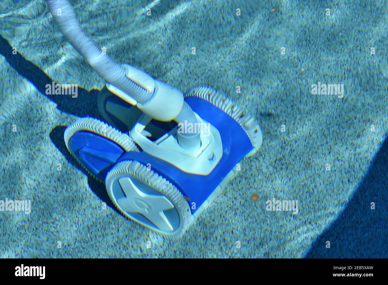 A swimming pool cleaning system at work Stock Photo Alamy