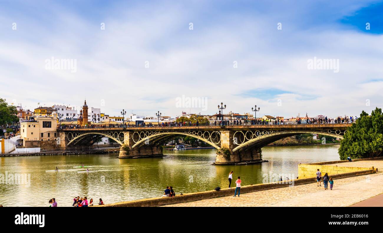 The Isabel II Bridge on the Guadalquivir River in Seville, Andalusia, Spain Stock Photo