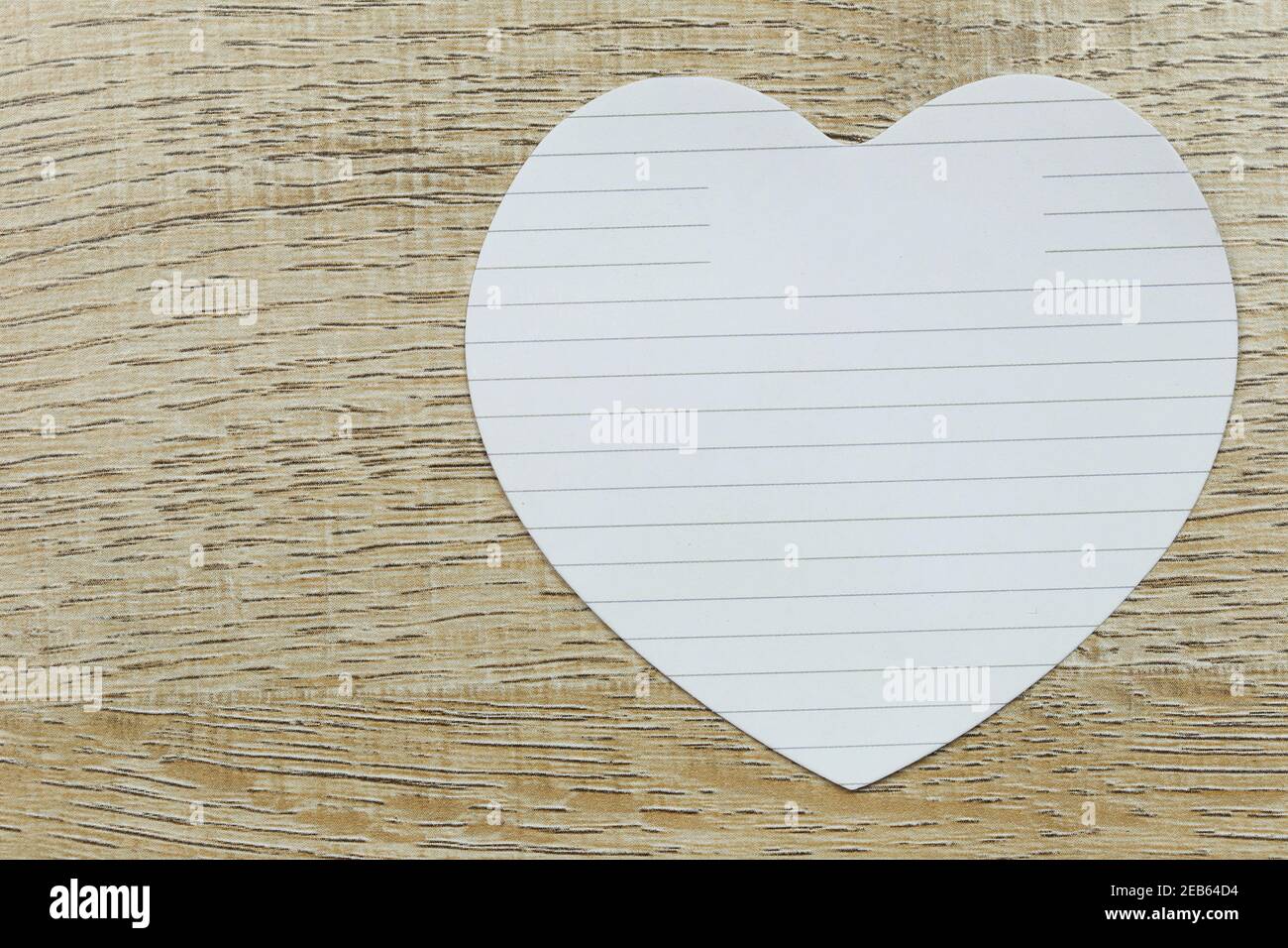 ฺBlank heart of white paper placed on the wooden floor and have copy ...