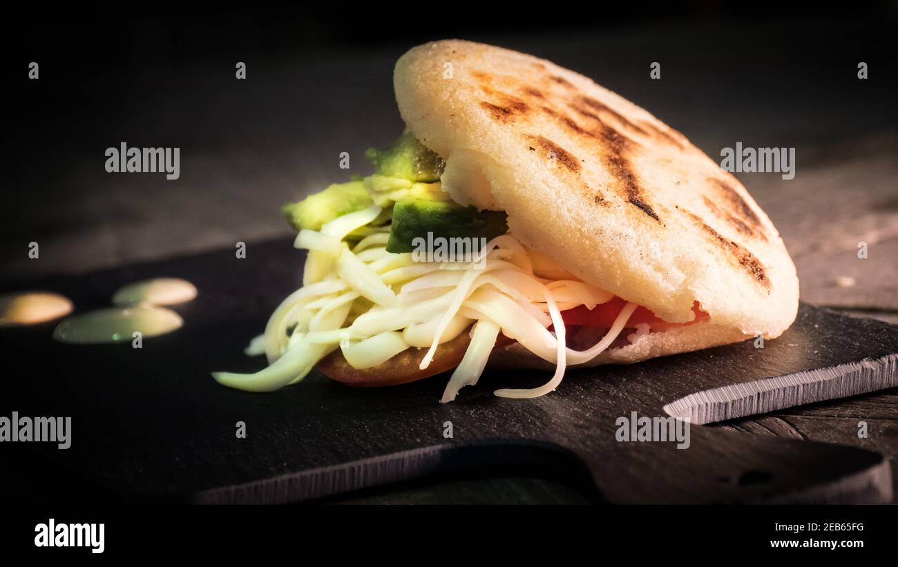 Delicious arepa with cheese Stock Photo - Alamy