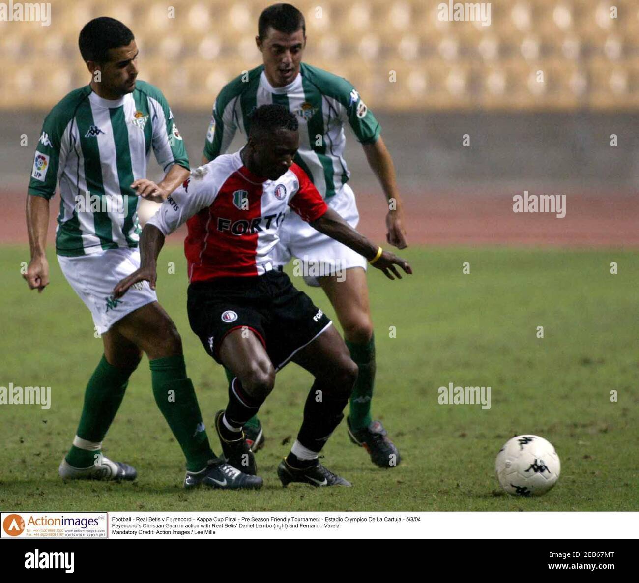 Football - Real Betis v Feyenoord - Kappa Cup Final - Pre Season Friendly  Tournament - Estadio Olympico De La Cartuja - 5/8/04 Feyenoord's Christian  Gyan in action with Real Betis' Daniel