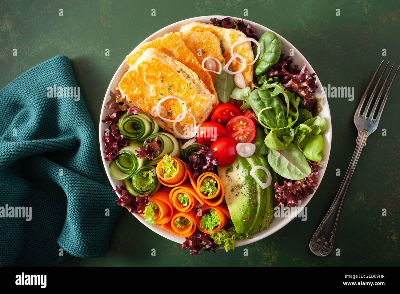 ketogenic paleo diet lunch bowl. halloumi cheese, avocado carrot