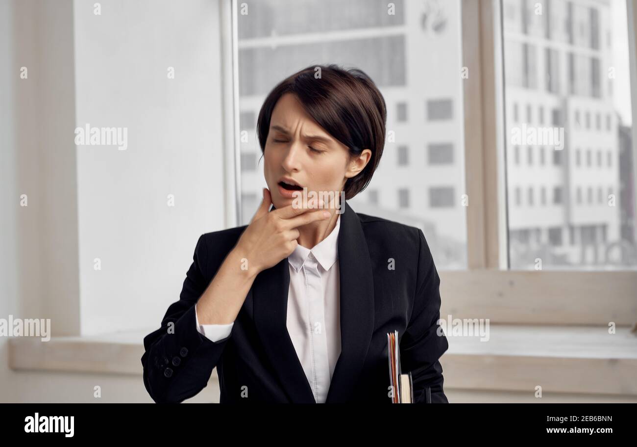 finance model woman in black jacket with documents in hands Stock Photo