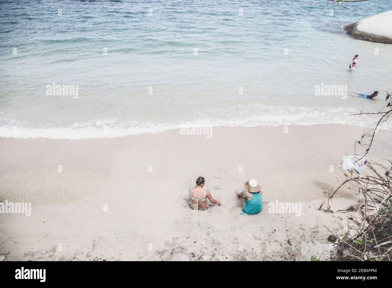 ST MARTA, COLOMBIA - Dec 10, 2020: People seating on the beach, enjoying quite time Stock Photo