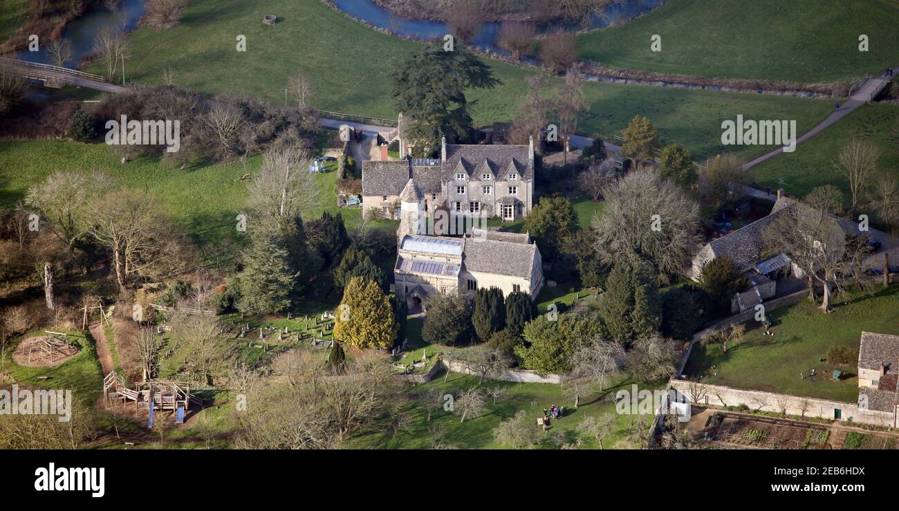 aerial view of St Marys Church Cogges in Witney, Oxfordshire (view also shows Cogges Church Centre & a large house (possibly rectory) at the back Stock Photo
