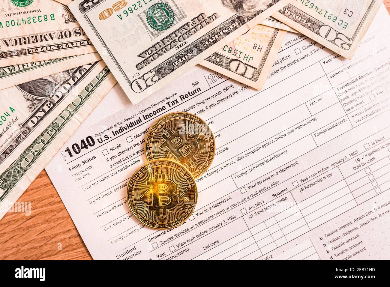 Form 1040 for 2020 with bitcoin coins for reporting of gains from cyber  currency trading or investment Stock Photo - Alamy