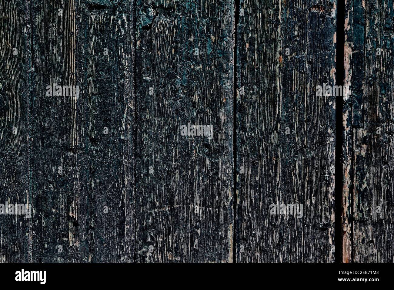 Dark distressed wood texture. Grunge distressed wooden door boards. Old