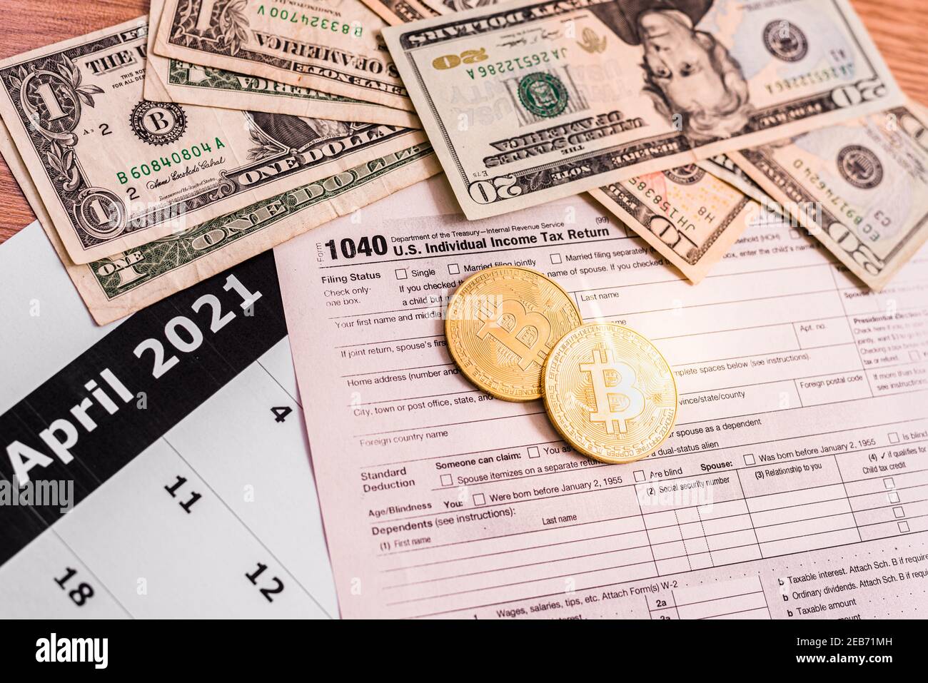 Form 1040 for 2020 with bitcoin coins for reporting of gains from cyber  currency trading or investment Stock Photo - Alamy