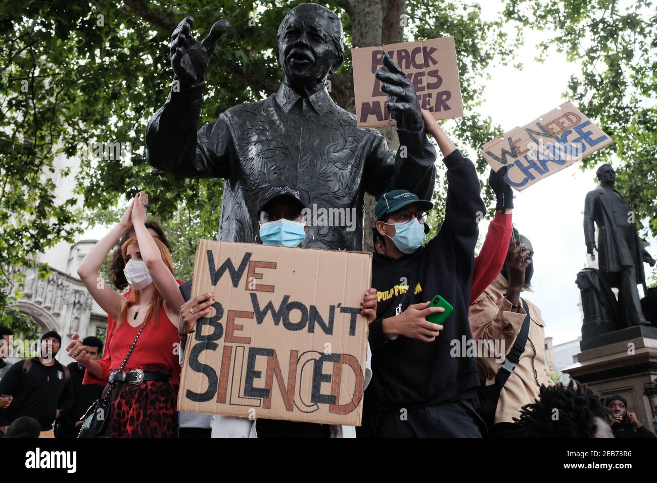 LONDON - 3RD JUNE 2020: Black Lives Matter protest. Protesters stand by Nelson Mandela statue on Parliament Square. Stock Photo