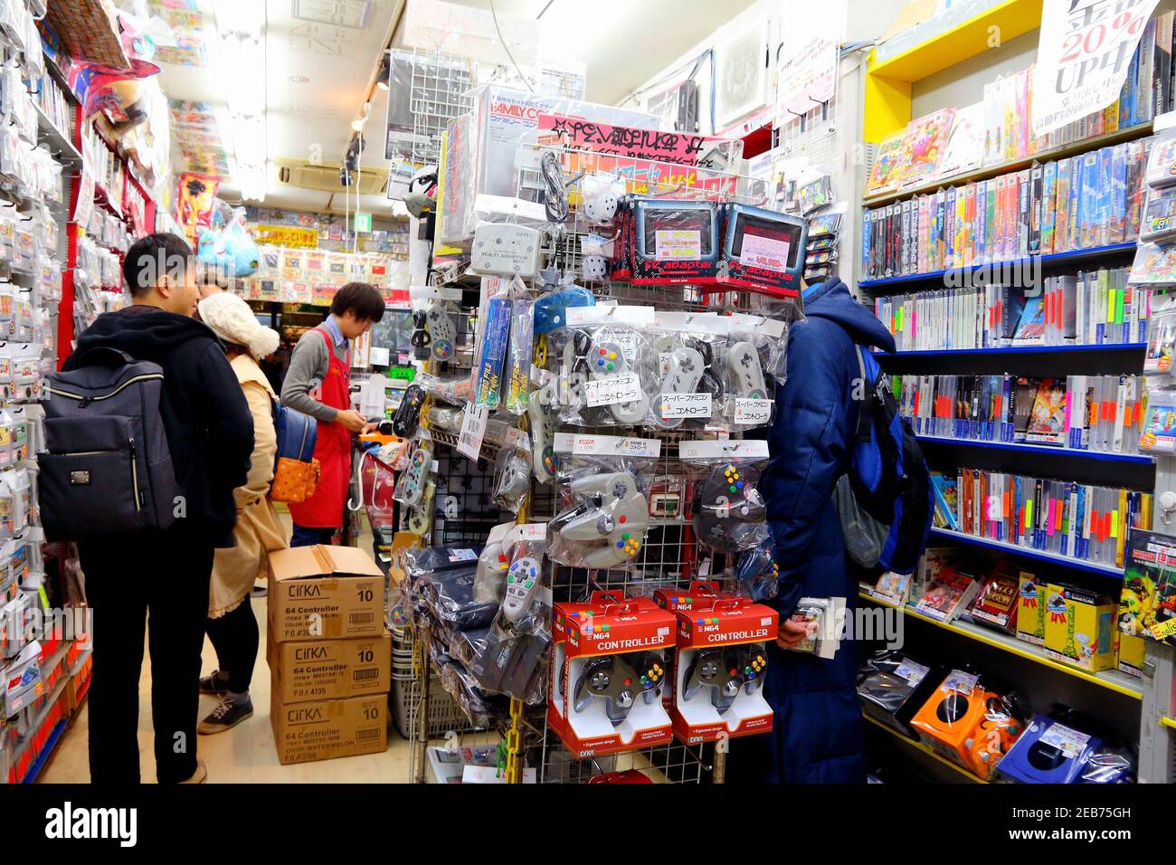 TOKYO, JAPAN - DECEMBER 4, 2016: People visit retro gaming collectible store in Akihabara district of Tokyo, Japan. Akihabara Electric District specia Stock Photo