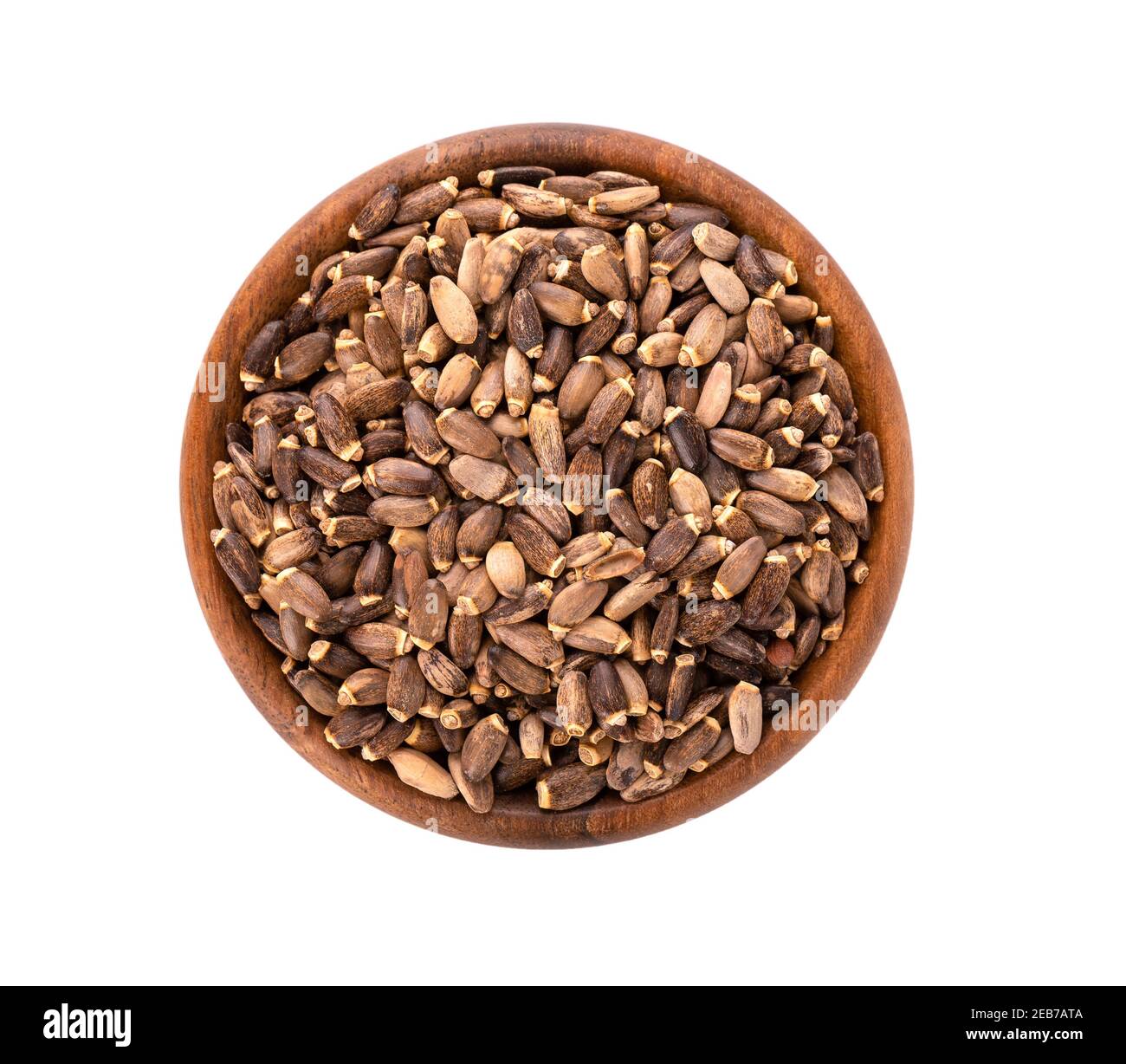 Milk Thistle seed in wooden bowl, isolated on white background. Silybum marianum, Scotch Thistle or Marian Thistle. Top view. Stock Photo