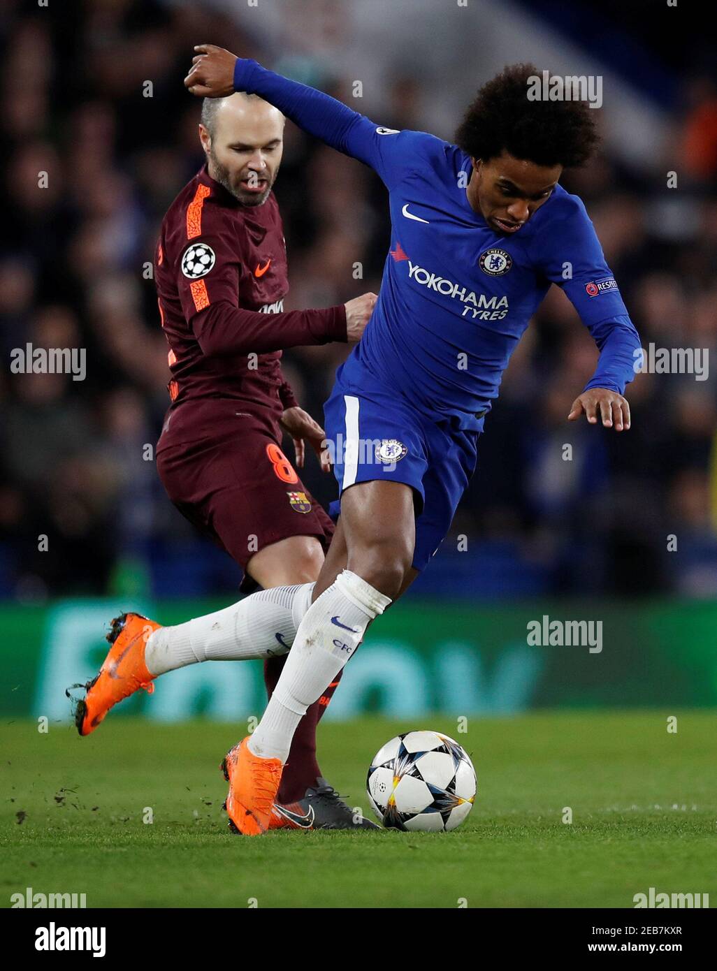 Soccer Football - Champions League Round of 16 First Leg - Chelsea vs FC Barcelona - Stamford Bridge, London, Britain - February 20, 2018   Chelsea's Willian in action with Barcelona’s Andres Iniesta   REUTERS/Eddie Keogh Stock Photo