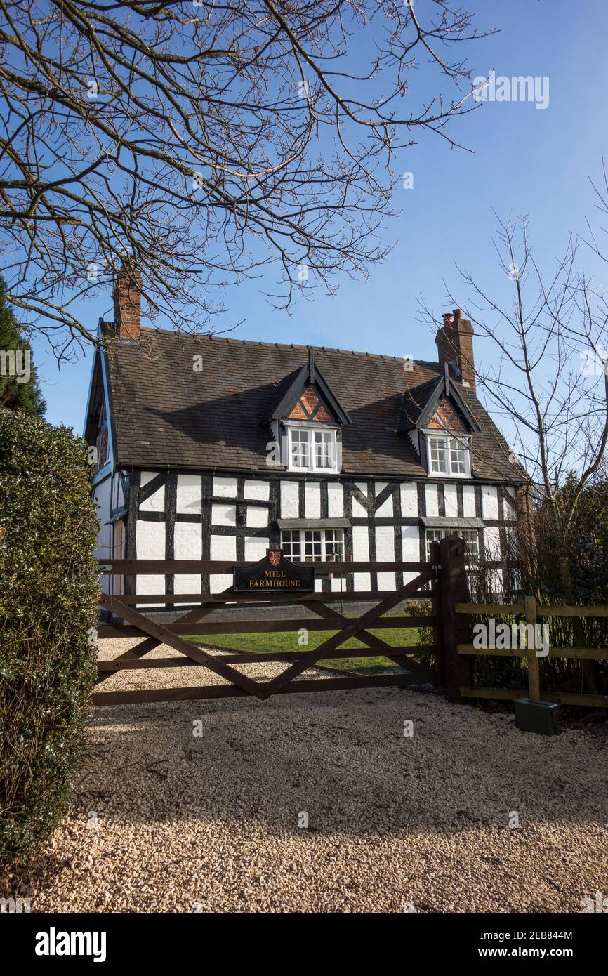 Mill farmhouse a half timbered Grade II Listed black and white Cheshire farm house in the village of  Barthomley part of the duchy of Lancaster estate Stock Photo