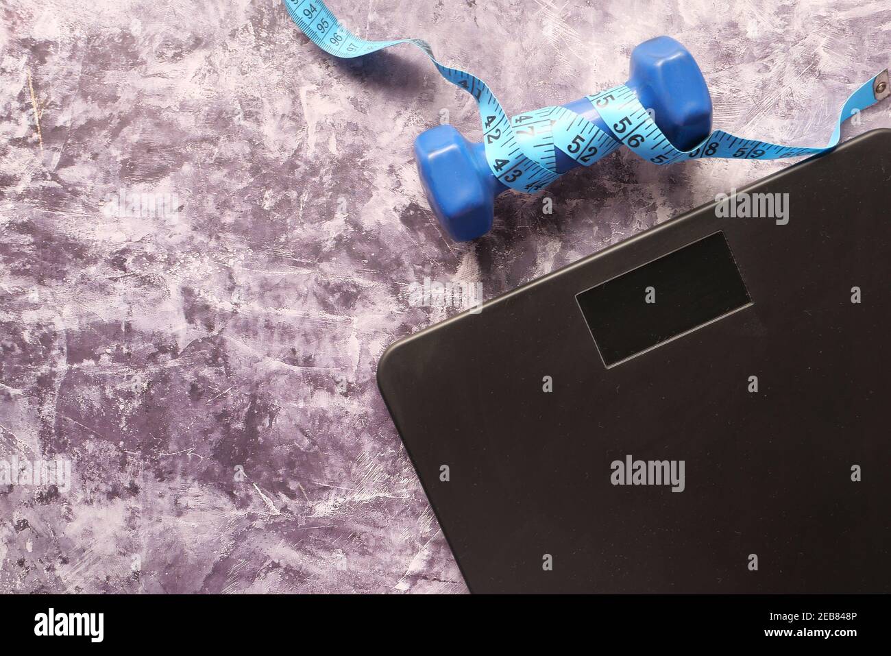 a tape measure and Bathroom scale on wooden floor Stock Photo Alamy