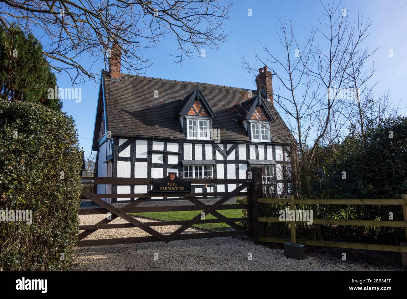 Mill farmhouse a half timbered Grade II Listed black and white Cheshire farm house in the village of  Barthomley part of the duchy of Lancaster estate Stock Photo