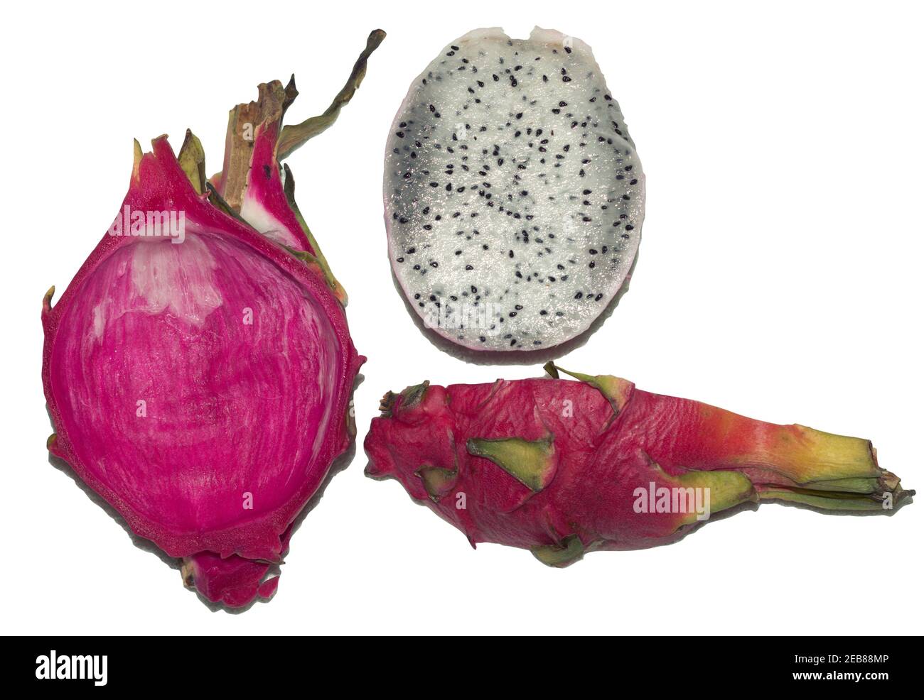 dragon fruit cut into pieces. half without scaly peel, a whole quarter of tropical exotic bright pink fruit with white flesh with small black seeds, i Stock Photo