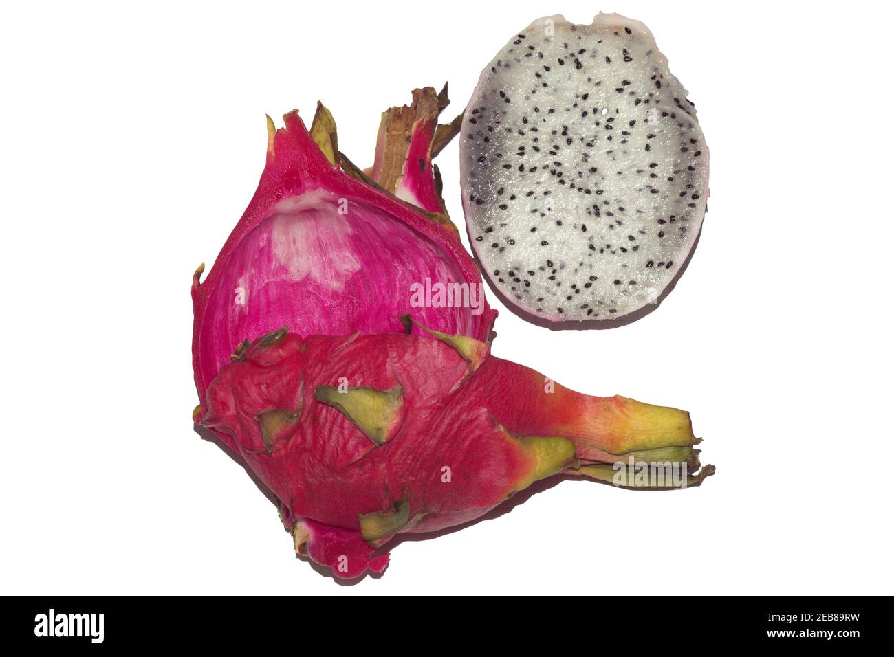 cut in half pitaya. half without scaly skin, a whole quarter of tropical exotic bright pink fruit with white flesh with small black seeds, isolated on Stock Photo