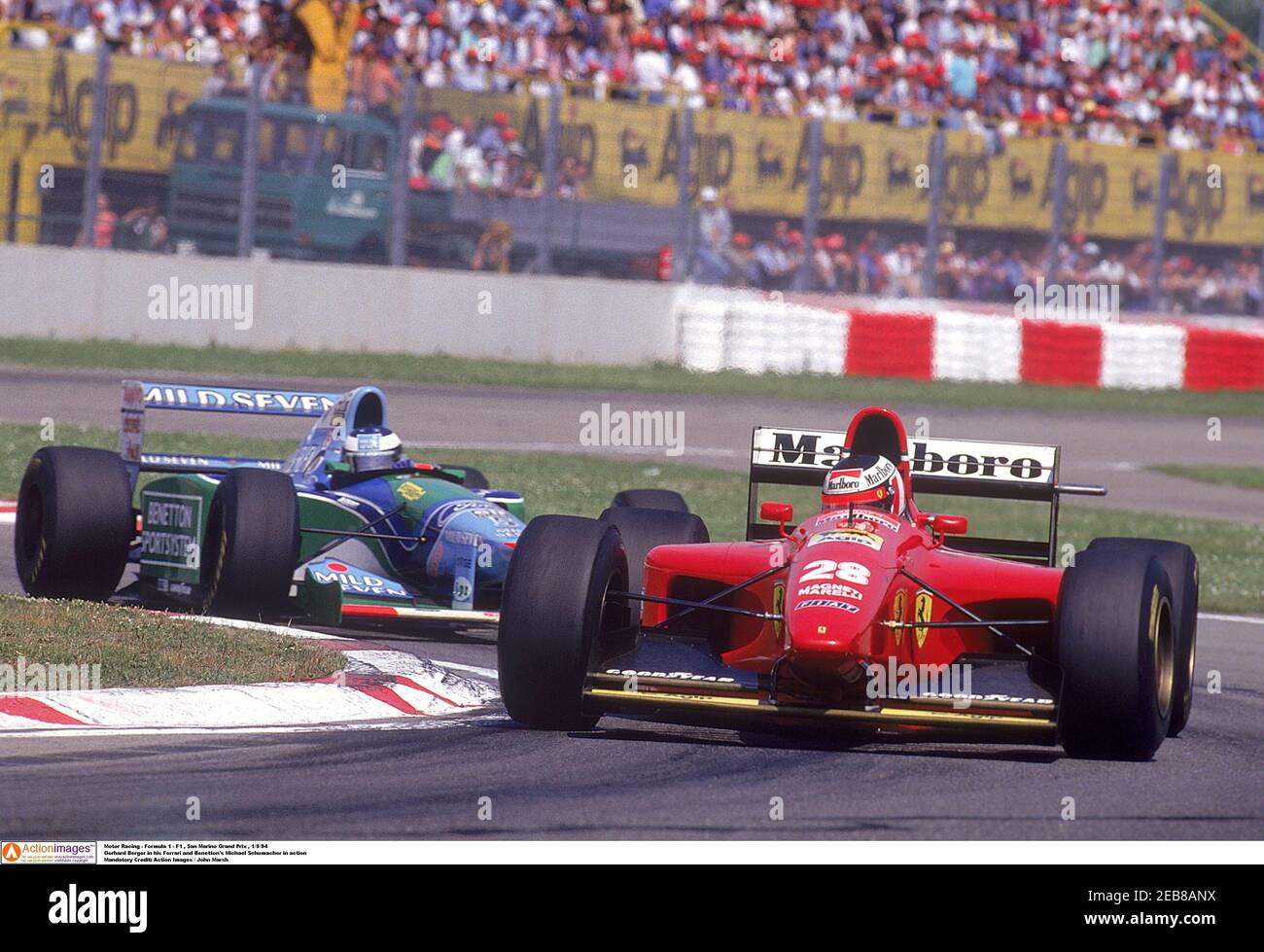 Motor Racing - Formula 1 - F1 , San Marino Grand Prix , 1/5/94 Gerhard  Berger in his Ferrari and Benetton's Michael Schumacher in action Mandatory  Credit: Action Images / John Marsh Stock Photo - Alamy