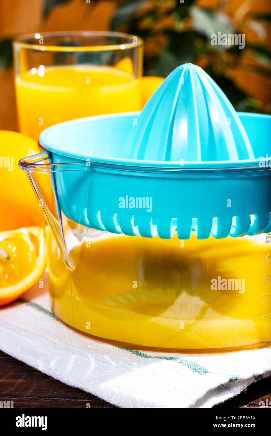 Citrus juicer. Making orange juice. Freshly squeezed orange juice Stock Photo Alamy