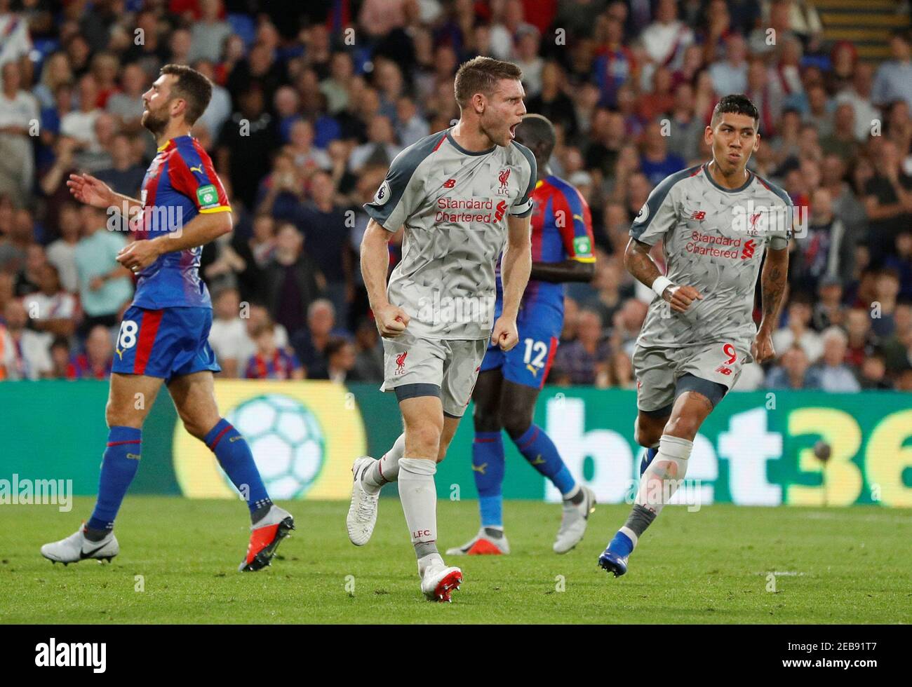 Soccer Football - Premier League - Crystal Palace v Liverpool - Selhurst Park, London, Britain - August 20, 2018  Liverpool's James Milner celebrates scoring their first goal from the penalty spot with Roberto Firmino                     Action Images via Reuters/John Sibley  EDITORIAL USE ONLY. No use with unauthorized audio, video, data, fixture lists, club/league logos or 'live' services. Online in-match use limited to 75 images, no video emulation. No use in betting, games or single club/league/player publications.  Please contact your account representative for further details. Stock Photo
