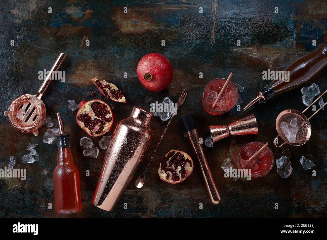 Alcoholic beverages or cocktails background with bar and pub utensils
