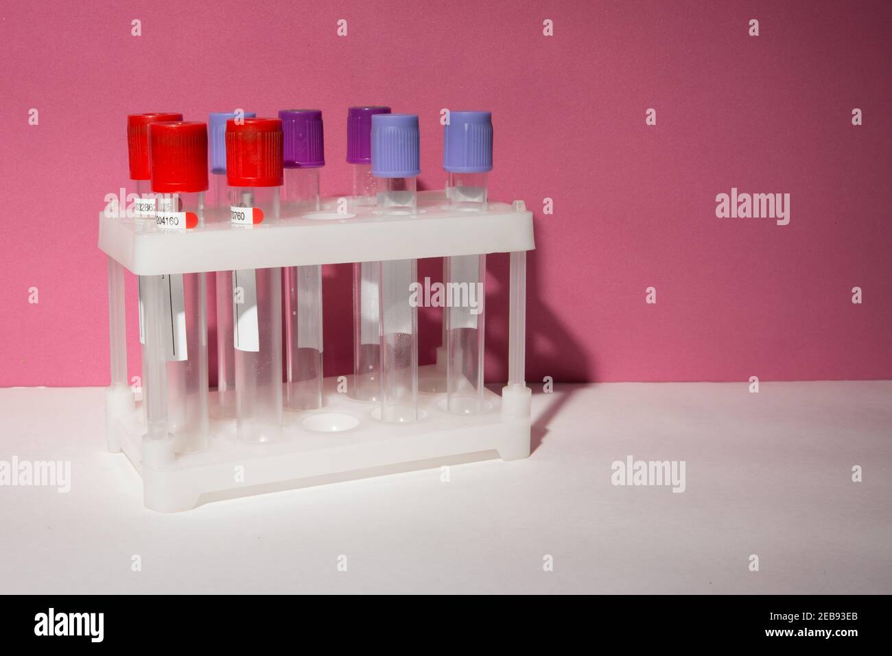 Laboratory test tubes on a pink background isolated Stock Photo Alamy