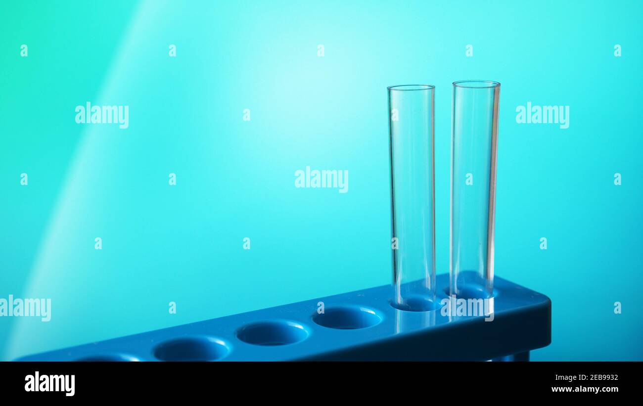 Test-tubes on a blue stand against blurred blue background Stock Photo ...