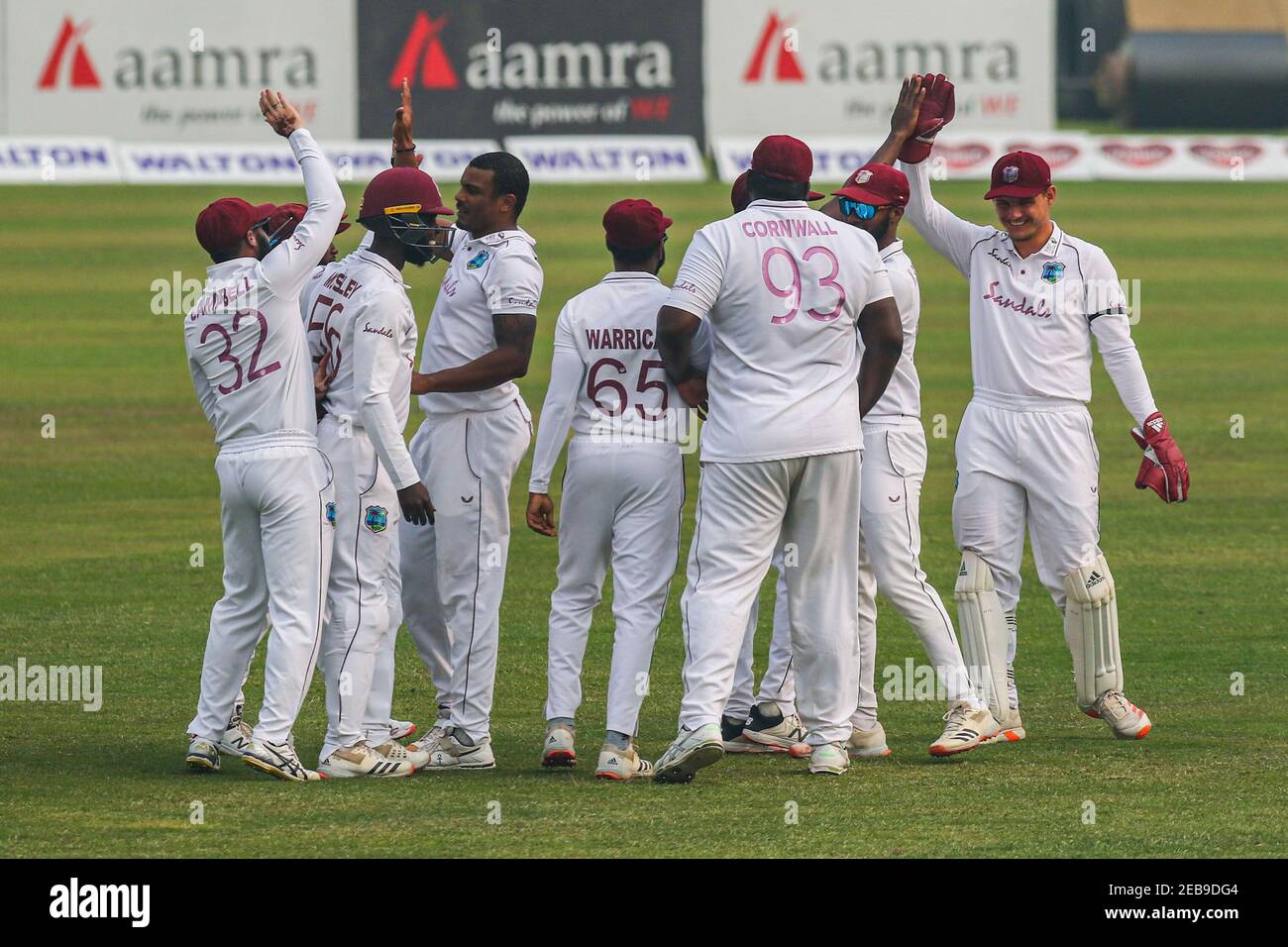 West Indies cricketers celebrate after the dismissal of Bangladeshs player during the second day of the second Test cricket match between West Indies and Bangladesh at the Sher-e-Bangla National Cricket Stadium