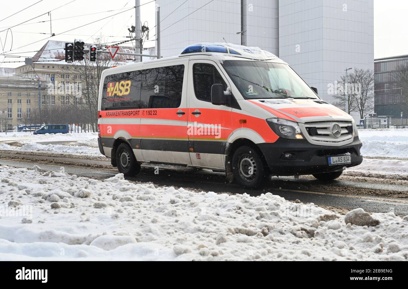 Leipzig, Germany. 10th Feb, 2021. An ASB (Arbeiter Samariter Bund)  "ambulance" makes its way along a street cleared of snow in Leipzig.  Credit: Volkmar Heinz/dpa-Zentralbild/ZB/dpa/Alamy Live News Stock Photo -  Alamy