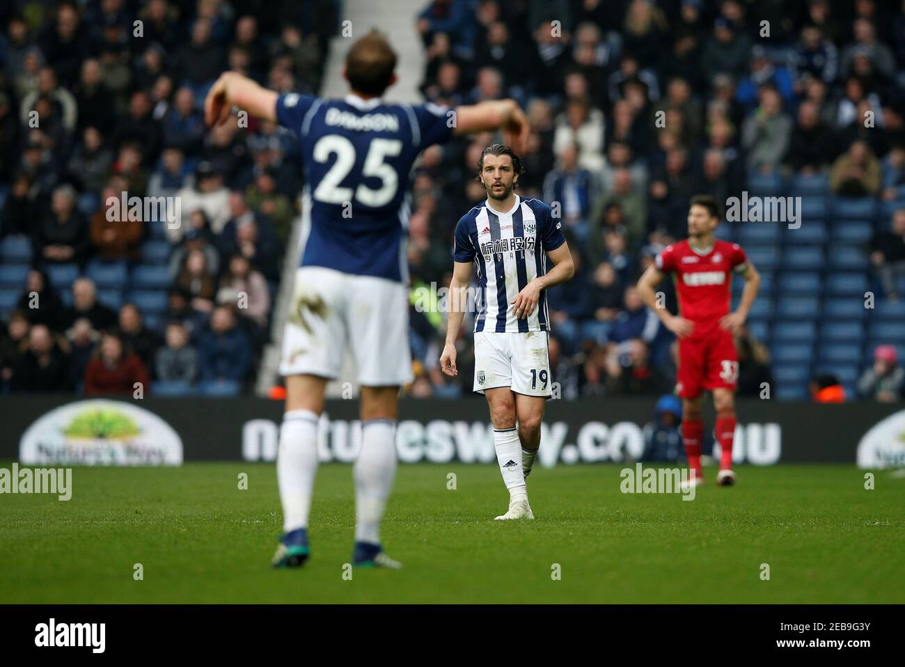 Soccer Football - Premier League - West Bromwich Albion vs Swansea City - The Hawthorns, West Bromwich, Britain - April 7, 2018   West Bromwich Albion's Jay Rodriguez and Craig Dawson               REUTERS/Andrew Yates    EDITORIAL USE ONLY. No use with unauthorized audio, video, data, fixture lists, club/league logos or 'live' services. Online in-match use limited to 75 images, no video emulation. No use in betting, games or single club/league/player publications.  Please contact your account representative for further details. Stock Photo