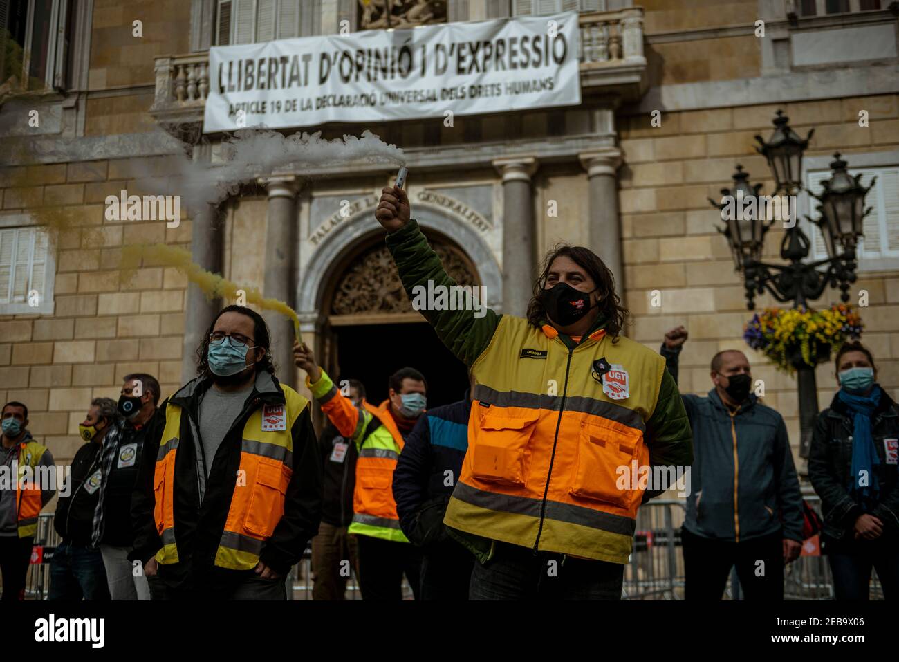 Barcelona, Spain. 12th Feb, 2021. Paramedics demonstrate for wage justice in front of the Catalan Government Credit: Matthias Oesterle/Alamy Live News Stock Photo