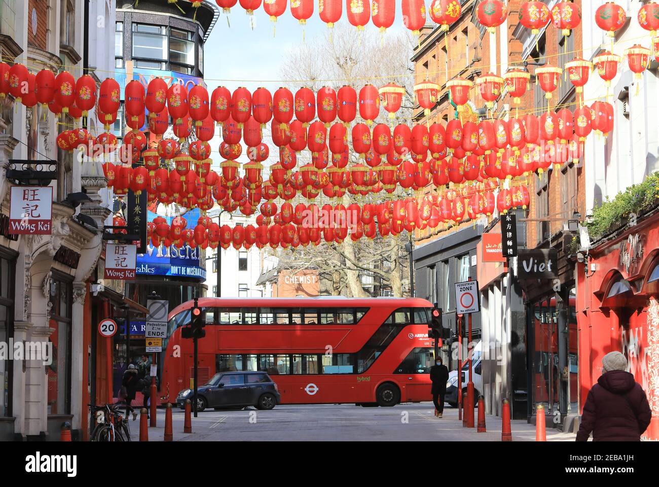 London, UK, February 12th 2021. Traditional lanterns up for Chinese New Year celebrations in China Town, Soho, London, UK. Covid restrictions and freezing temperatures meant people had to celebrate at home for the start of the Year of the Ox. Monica Wells/Alamy Live News Stock Photo