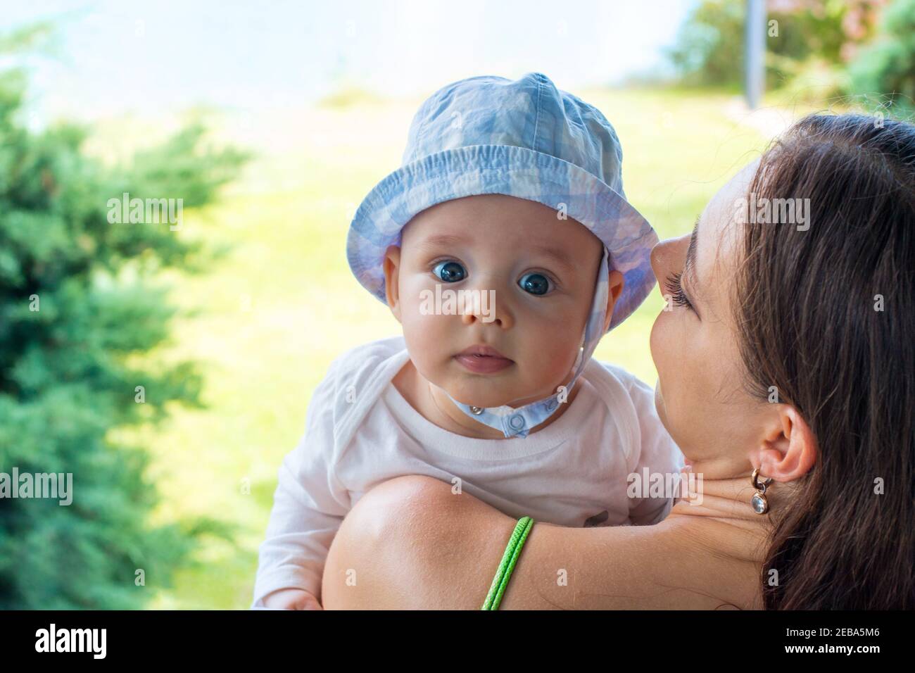 Portrait of baby in mother's arms Stock Photo