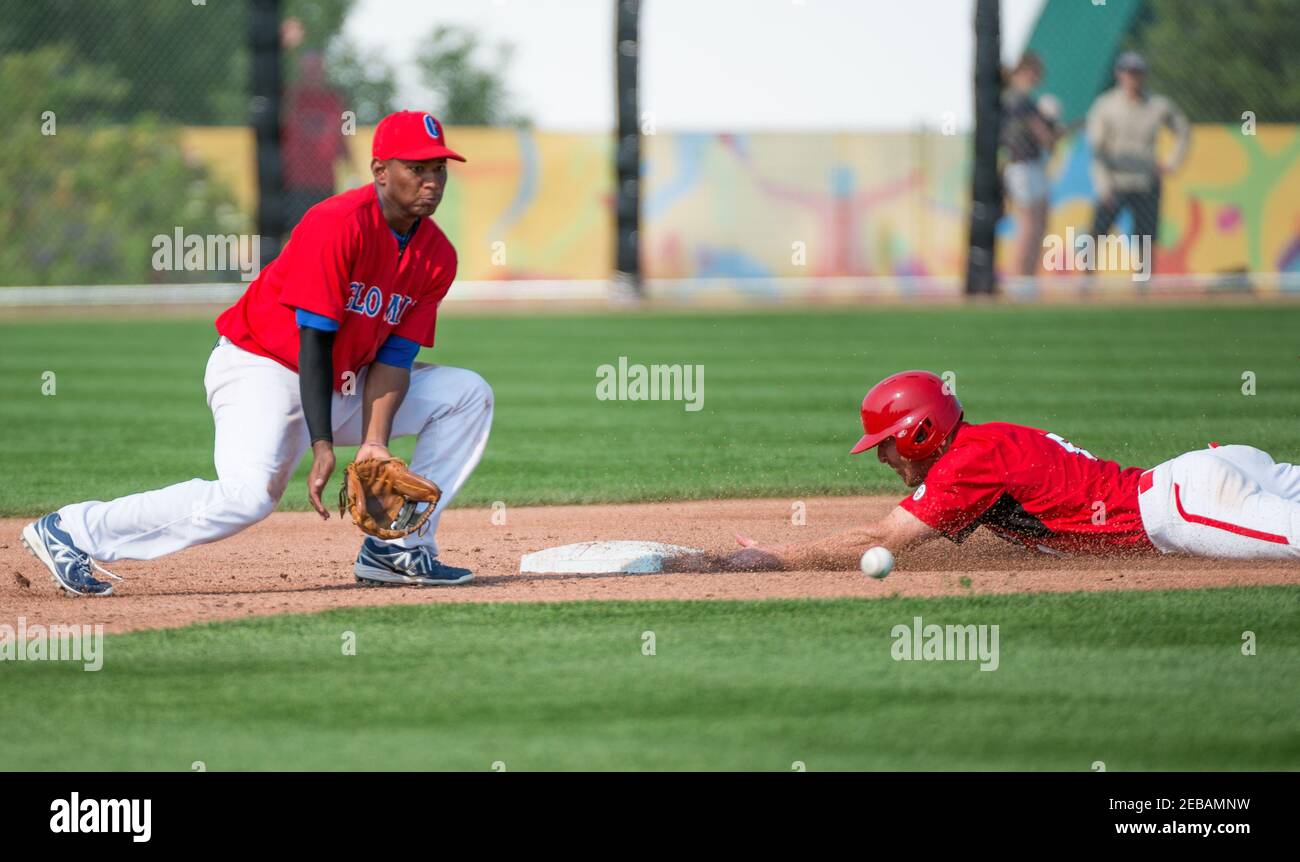 Toronto Pan American Games 2015, Baseball tournament: Canada team vs Colombia, a North American player steals the second base with enough time to get Stock Photo