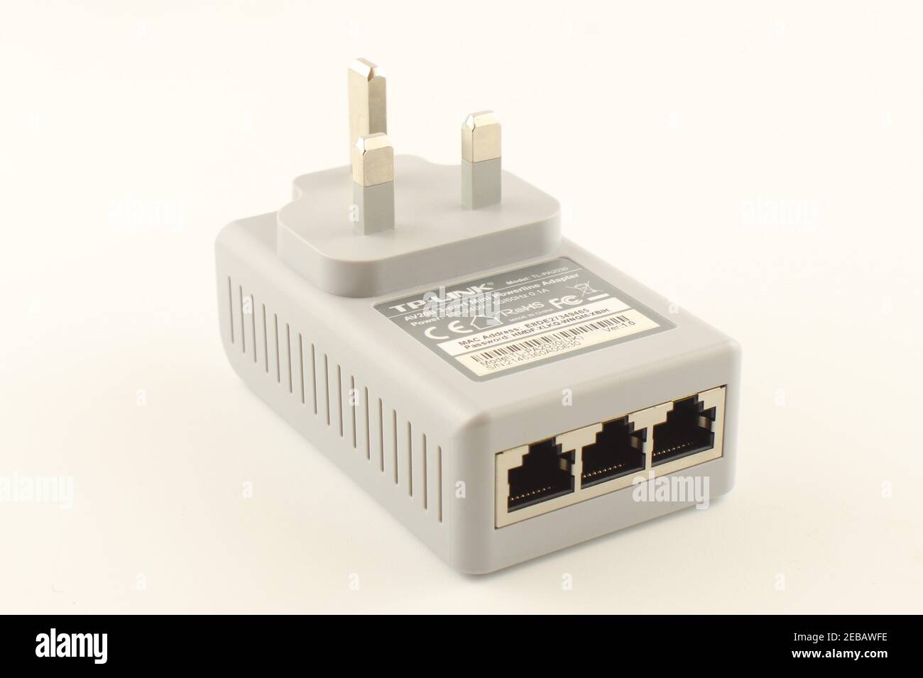 power line adapter with three ports isolated on a white