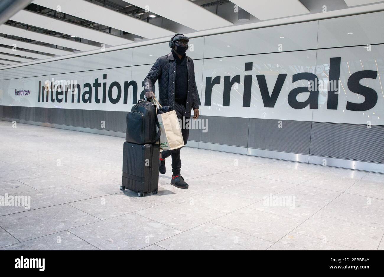 International Arrivals at Heathrow Terminal 5. People arriving in England from 'red list' countries, including UK residents, must isolate for 10 days. Stock Photo