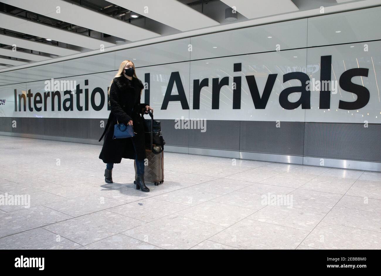 International Arrivals at Heathrow Terminal 5. People arriving in England from "red list" countries, including UK residents, must isolate for 10 days. Stock Photo
