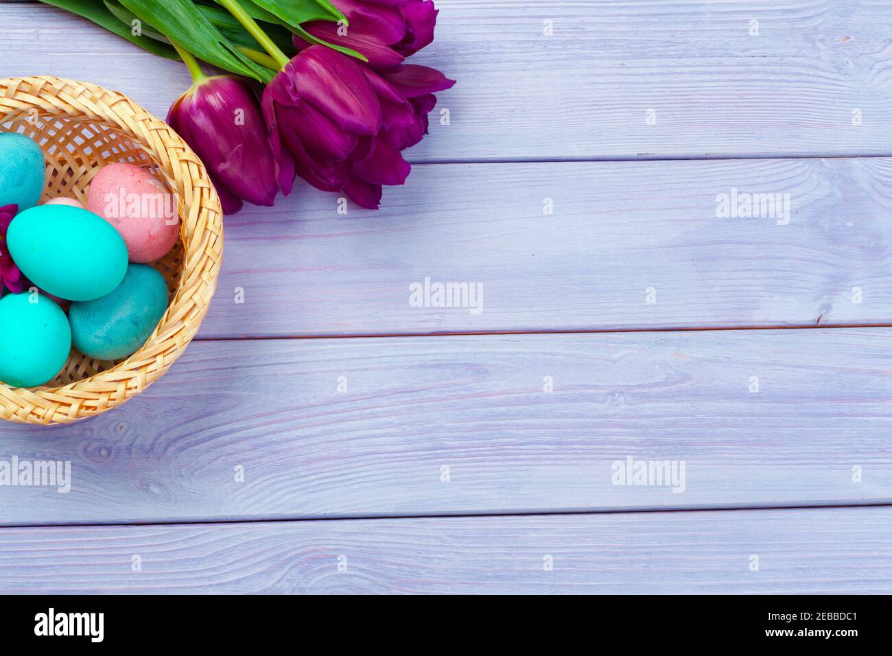 Easter background. colorful eggs in a nest of straw Stock Photo - Alamy