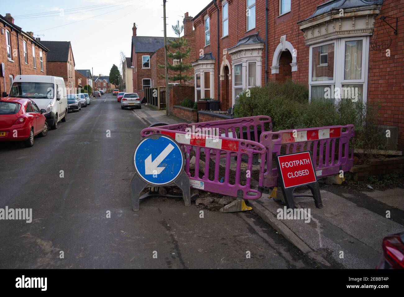 Local road works, footpath closed, safety, operator's, narrow to permit pedestrians, blocked access, barriers, disabled ramp access, kerb, gas works. Stock Photo