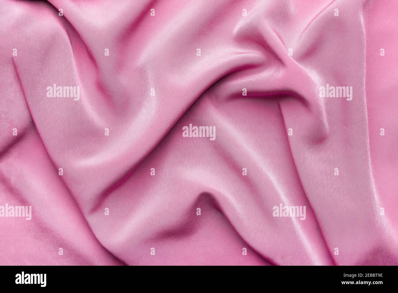Pink silky elegant fabric as a background Stock Photo