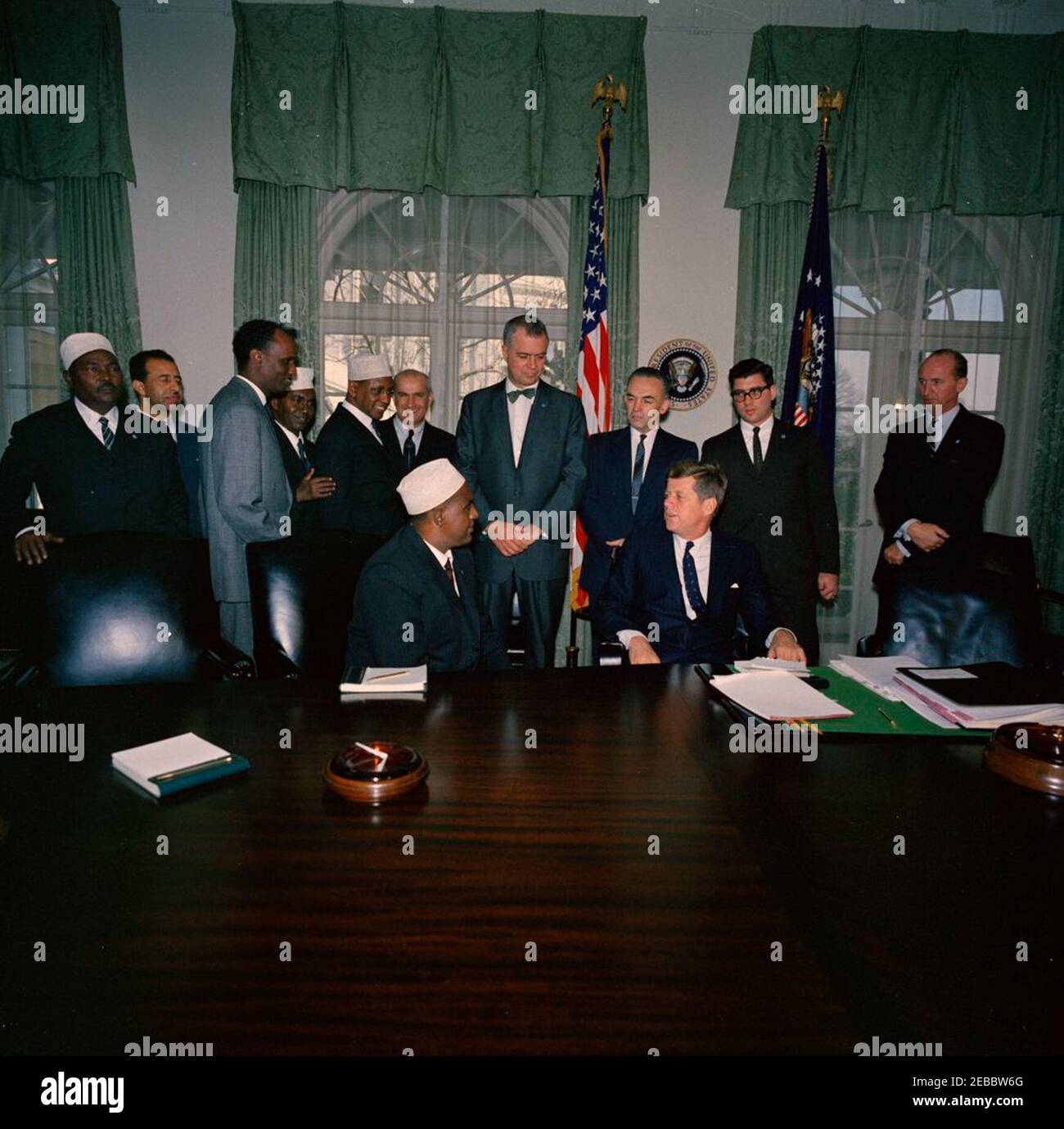 Meeting with Abdirashid Ali Shermarke, Prime Minister of the Somali Republic, 12:00PM. President John F. Kennedy meets with Prime Minister of the Somali Republic, Dr. Abdirashid Ali Shermarke (seated in center). Also pictured: Ambassador of the Somali Republic, Dr. Omar Mohallim Mohamed; Minister of Foreign Affairs of the Somali Republic, Abdullahi Issa Mohamud; U.S. Deputy Assistant Secretary of State for African Affairs, Henry J. Tasca; Assistant Secretary of State for African Affairs, G. Mennen u0022Soapyu0022 Williams; deputy administrator of the Agency for International Development (AID Stock Photo