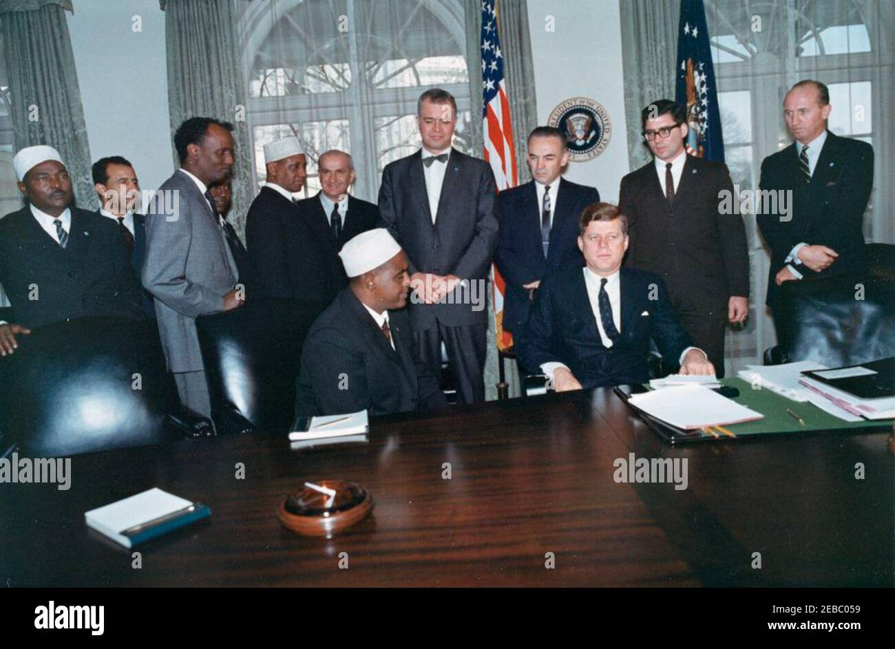 Meeting with Abdirashid Ali Shermarke, Prime Minister of the Somali Republic, 12:00PM. President John F. Kennedy meets with Prime Minister of the Somali Republic, Dr. Abdirashid Ali Shermarke (seated in center). Also pictured: Ambassador of the Somali Republic, Dr. Omar Mohallim Mohamed; Minister of Foreign Affairs of the Somali Republic, Abdullahi Issa Mohamud; U.S. Deputy Assistant Secretary of State for African Affairs, Henry J. Tasca; Assistant Secretary of State for African Affairs, G. Mennen u0022Soapyu0022 Williams; deputy administrator of the Agency for International Development (AID Stock Photo