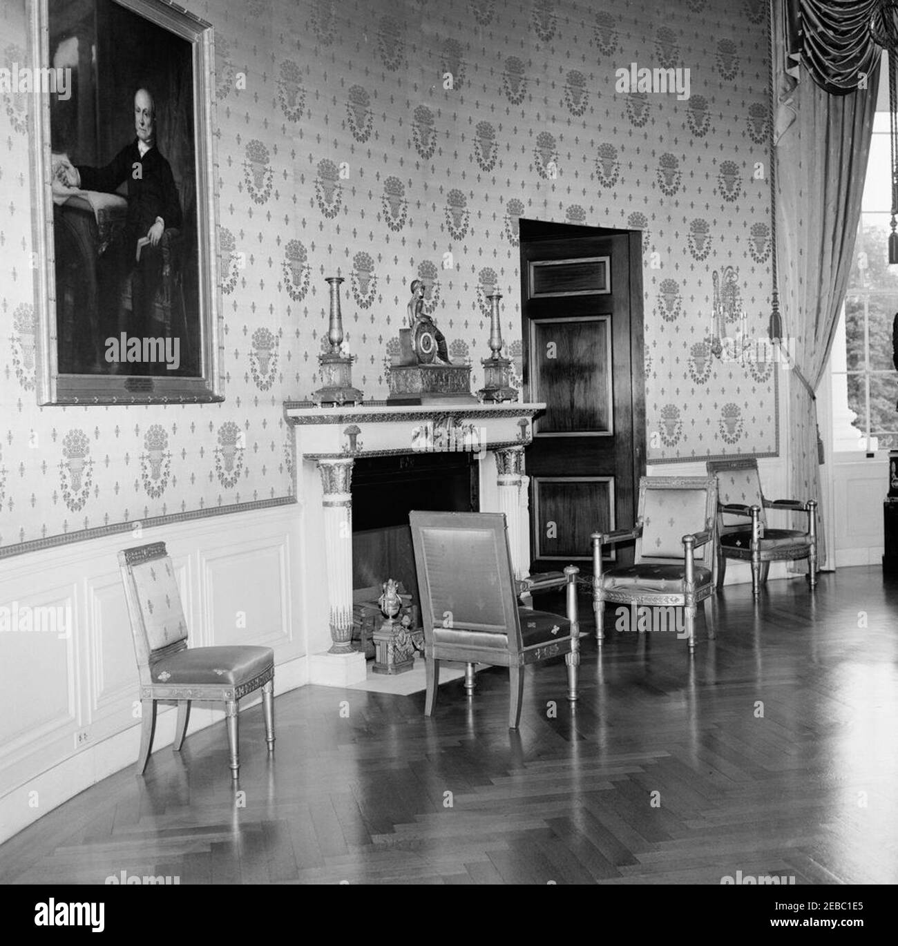 White House Rooms: Red, Blue Rooms. View of a mantel and fireplace in the Blue Room of the White House, Washington, D.C. A portrait of John Quincy Adams hangs on wall at left. Stock Photo